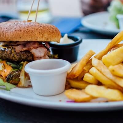 Plate with a burguer, french fries and mayo on it